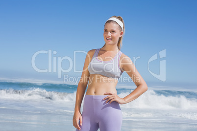 Sporty smiling blonde on the beach