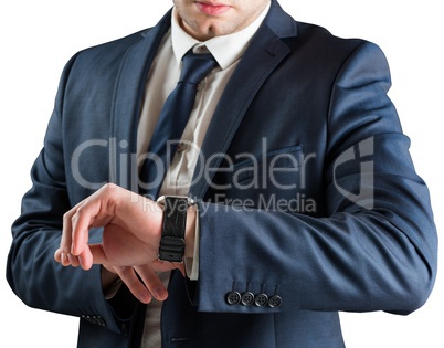 Businessman checking the time on watch