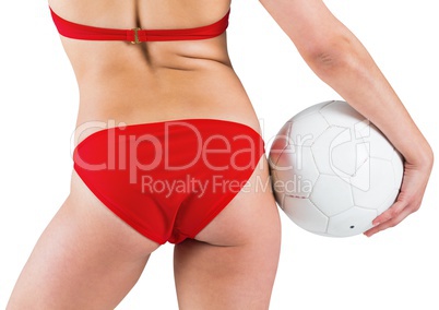 Fit girl in bikini holding football