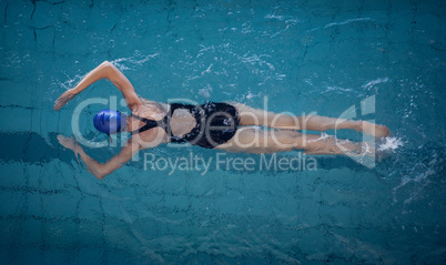 Fit woman swimming in the pool