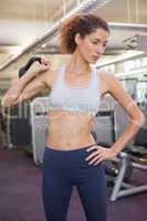 Fit woman lifting up kettlebell