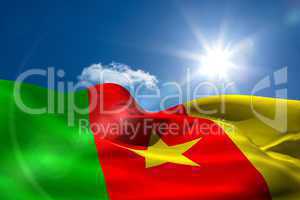 Cameroon national flag under sunny sky