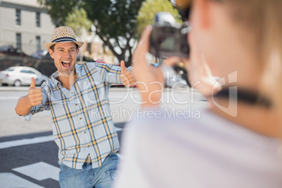 Happy hip man posing for his girlfriend