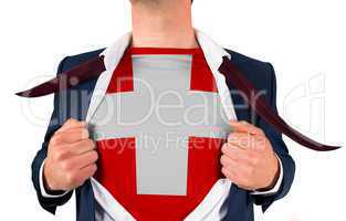 Businessman opening shirt to reveal swiss flag