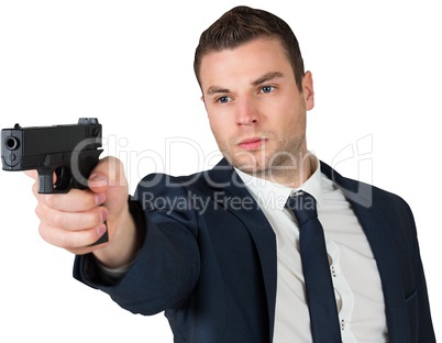 Serious businessman pointing a gun