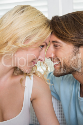 Cute couple facing each other and smiling