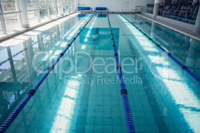 Large swimming pool with sunlight streaming in