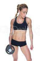 Female bodybuilder holding large black dumbbell with arm down