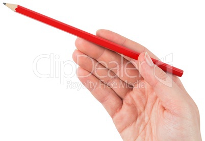 Hand holding red pencil
