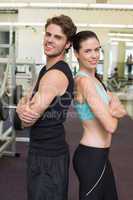 Fit attractive couple smiling at camera