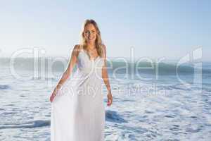 Pretty blonde at the beach in white sundress