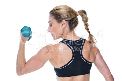 Female bodybuilder holding a dumbbell