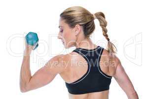 Female bodybuilder holding a dumbbell
