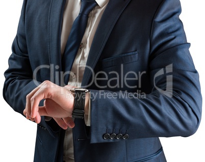 Businessman checking the time on watch