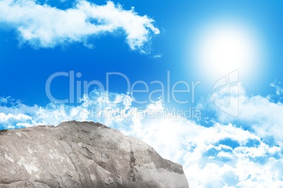 Large rock overlooking blue sky