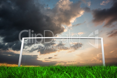 Football goal under cloudy sky