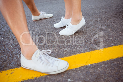 Couples feet on the road