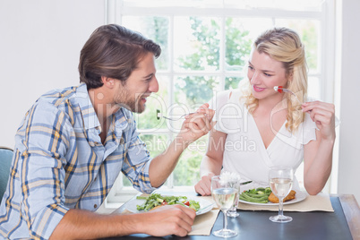 Happy couple enjoying a meal together