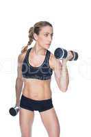 Female bodybuilder working out with large dumbbells