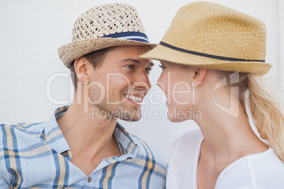 Young hip couple sitting on bench