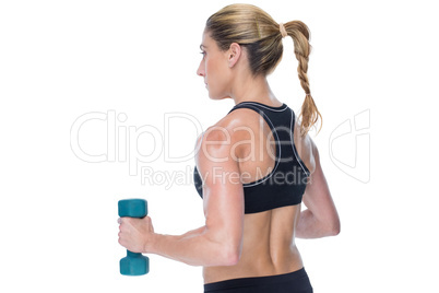 Female bodybuilder holding a blue dumbbell