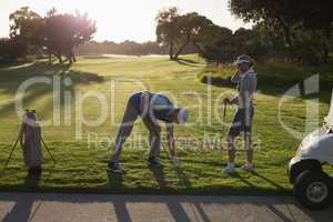 Golfing couple teeing off for the day