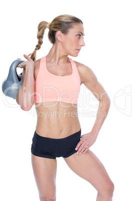 Female blonde crossfitter holding kettlebell