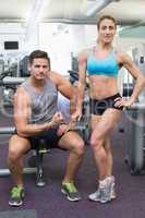 Bodybuilding man and woman posing for the camera