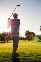 Golfer teeing off for the day