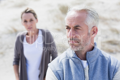 Couple not talking after argument on the beach
