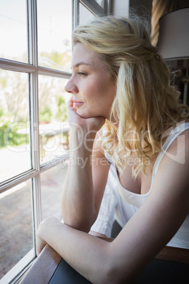 Pretty blonde sitting by the window