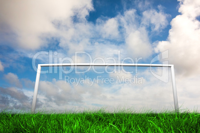 Football goal under blue cloudy sky