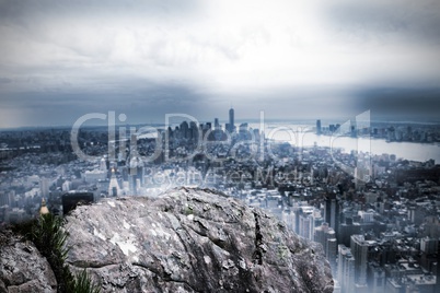 Large rock overlooking huge city