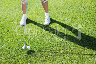 Lady golfer teeing off for the day