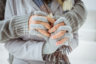 Cute couple in warm clothing holding hands