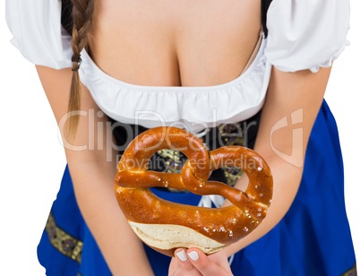 Oktoberfest girl bending and showing pretzel