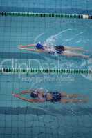 Female swimmers racing in the swimming pool