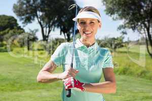 Female golfer smiling at camera