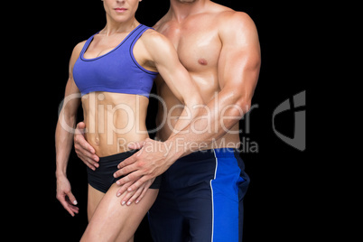 Fit bodybuilding couple posing together