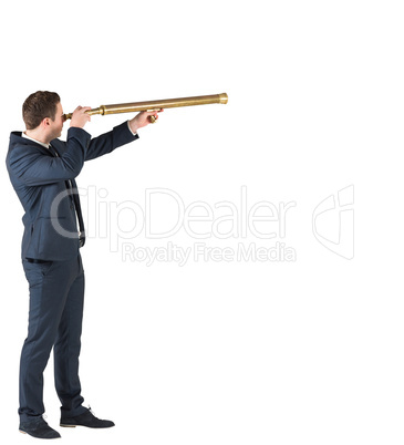 Businessman standing and looking through telescope