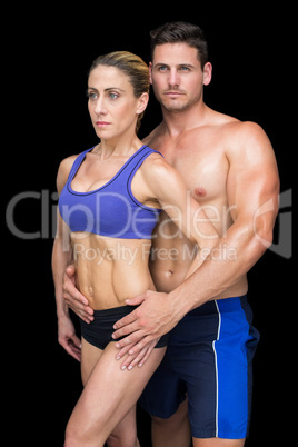 Fit bodybuilding couple posing together