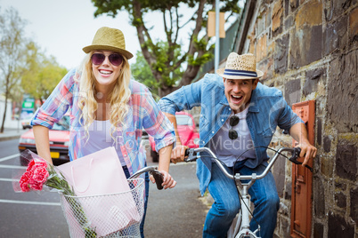 Hip young couple on a bike ride