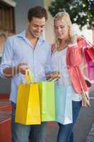 Stylish young couple on a shopping trip