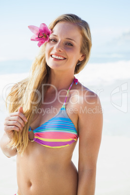Gorgeous blonde in bikini smiling at camera
