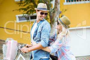 Hip young couple going for a bike ride