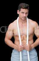 Strong crossfitter posing with rope around neck