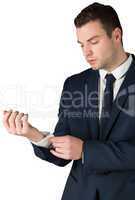 Businessman adjusting his cuffs on shirt