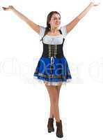 Pretty oktoberfest girl smiling with arms raised