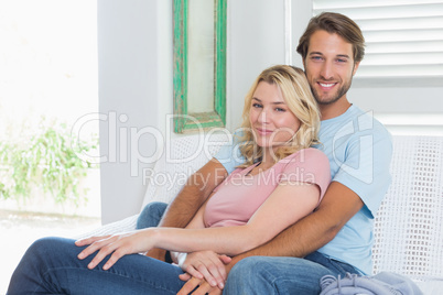 Happy couple relaxing together on the couch