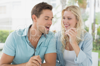 Hip young couple having desert together